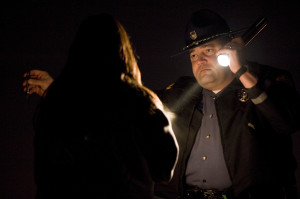 WSP Trooper Ben Taylor administers a field sobriety test to a driver who nearly crashed her car into a concrete barrier on state Highway 500 in December 2011. The driver was arrested on suspicion of DUI. (Steven Lane/The Columbian)