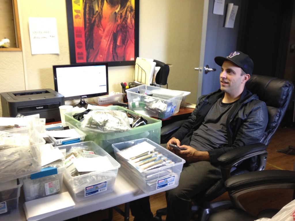 (Ramsey Hamide looks over an unprecedentedly large amount of stock at Main Street Marijuana. He said he doesn't anticipate having to close his doors because of product shortages again, and he's glad to be lowering his prices to consumers. -Sue Vorenberg/The Columbian)