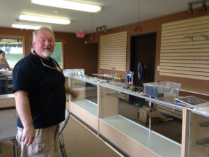 Jim Mullen, the owner of The Herbery, putting some of the final touches on his second store the day before it opened. 